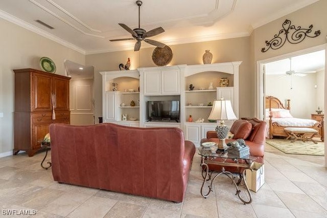 living room with built in shelves, ceiling fan, and crown molding