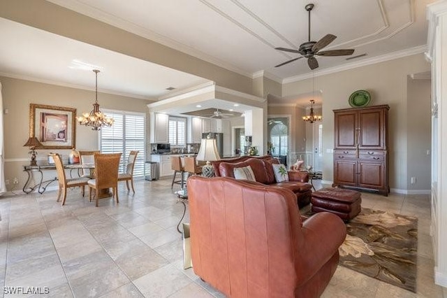 living room with crown molding and ceiling fan with notable chandelier