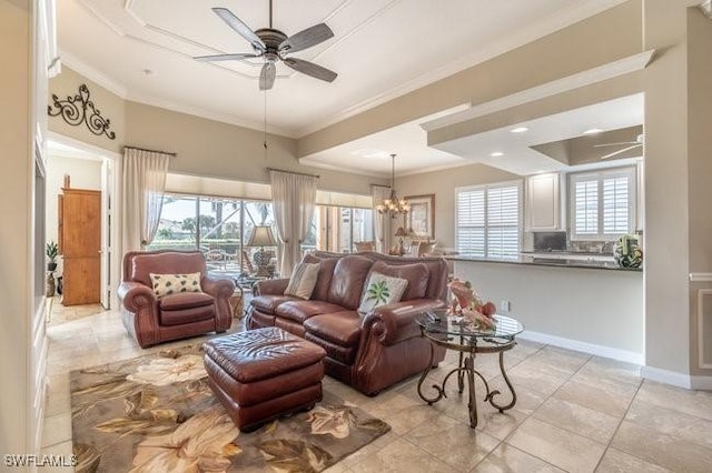 living room featuring light tile patterned floors, ceiling fan with notable chandelier, plenty of natural light, and ornamental molding