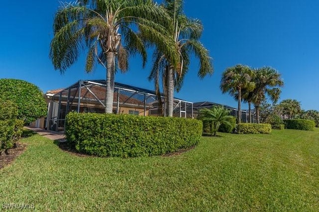 view of yard with a lanai