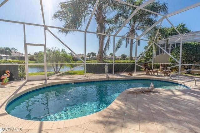 view of pool featuring a lanai, a patio area, and a water view