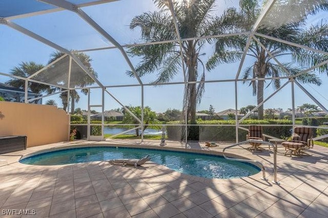 view of pool featuring a patio area and glass enclosure