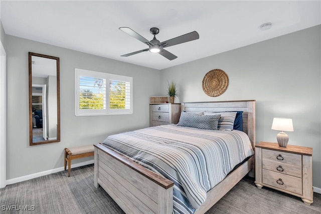 bedroom featuring dark colored carpet and ceiling fan