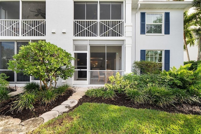 exterior space with ceiling fan