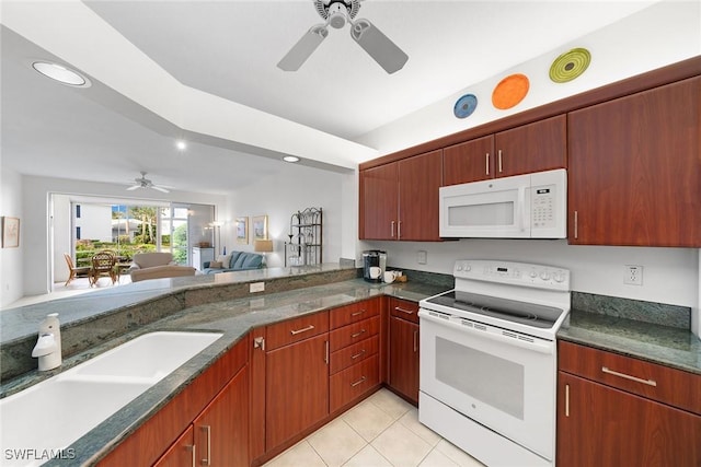 kitchen with light tile patterned flooring, white appliances, ceiling fan, and sink