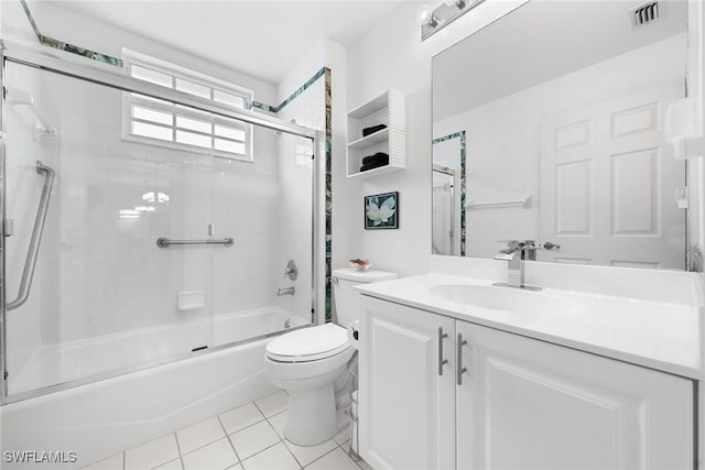 full bathroom featuring tile patterned flooring, vanity, toilet, and enclosed tub / shower combo