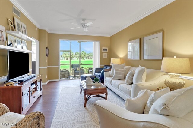 living room with crown molding, ceiling fan, and wood-type flooring