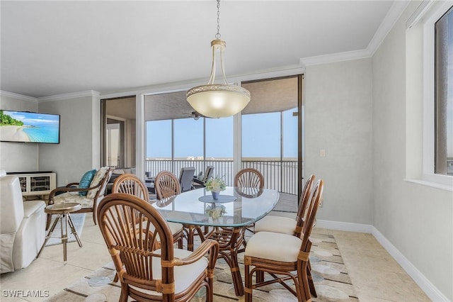 dining room with light tile patterned floors, a wall of windows, and crown molding