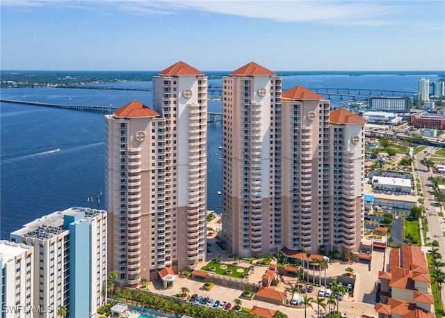 birds eye view of property with a water view