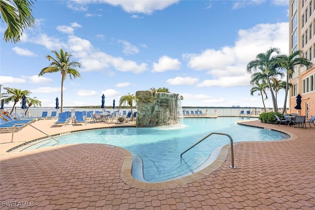 view of swimming pool featuring a patio area and pool water feature