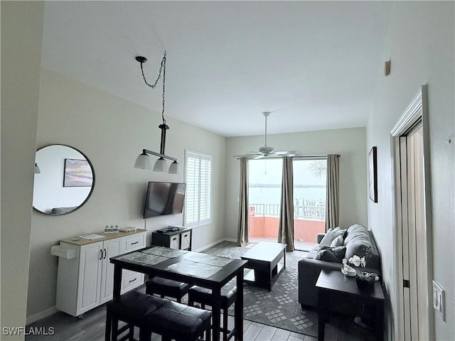 8771 Estero Blvd Unit 103, Fort Myers Beach, FL 33931 - living area with wood finished floors, a ceiling fan, and baseboards