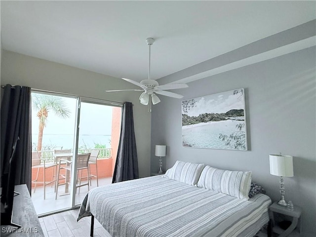 8771 Estero Blvd Unit 103, Fort Myers Beach, FL 33931 - bedroom with access to exterior, light wood-type flooring, and a ceiling fan