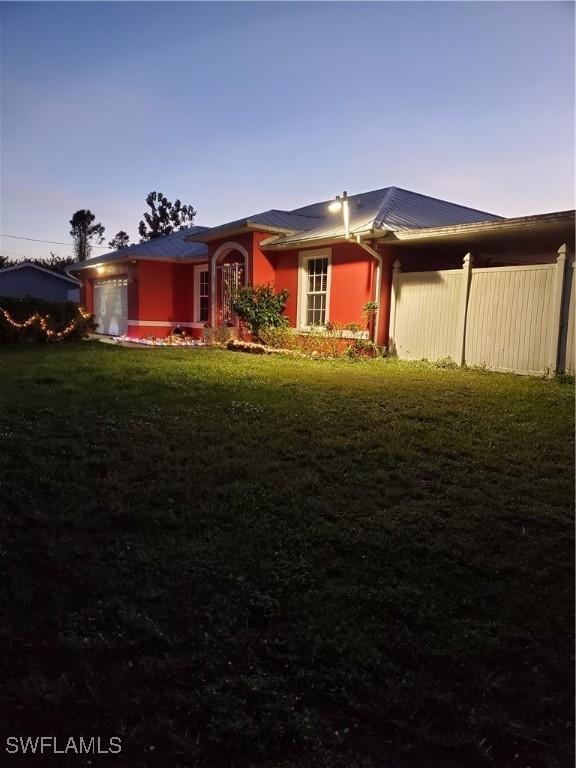 view of front of home with a lawn