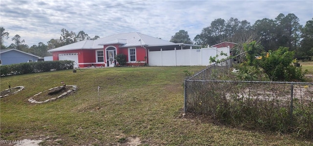 exterior space with a front yard and a garage