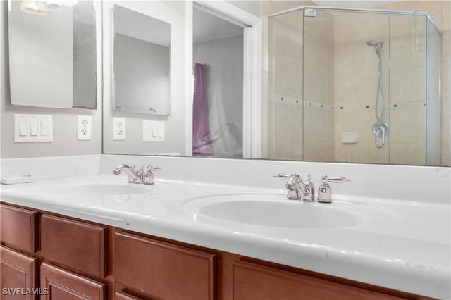 bathroom featuring vanity and a shower with door