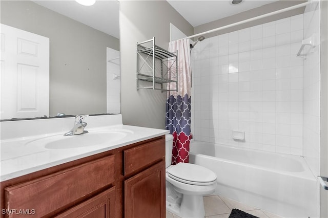 full bathroom featuring tile patterned floors, vanity, toilet, and shower / tub combo