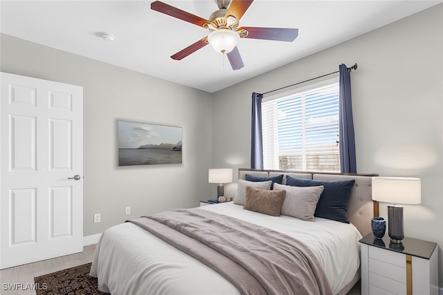 bedroom featuring ceiling fan and hardwood / wood-style floors