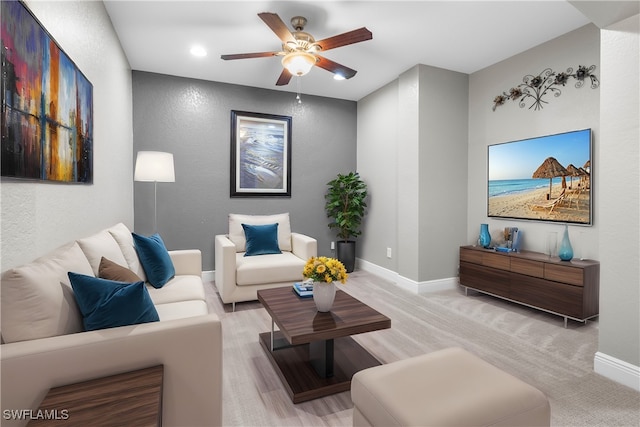 living room with light carpet and ceiling fan