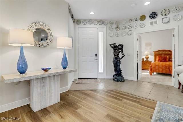 foyer with light wood-type flooring