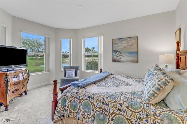 bedroom featuring light carpet