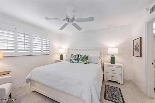 bedroom featuring ceiling fan, light tile patterned floors, and ornamental molding