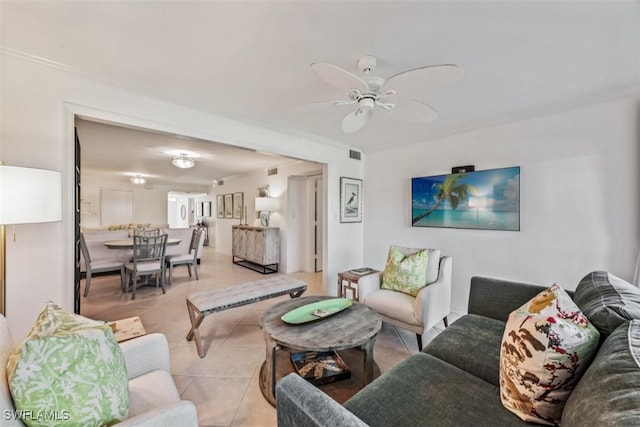 living room featuring ceiling fan and light tile patterned floors