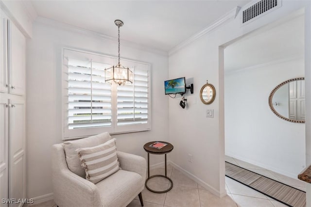 living area with light tile patterned floors, crown molding, and a chandelier