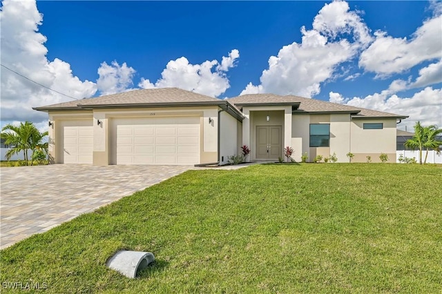 view of front of home featuring a garage and a front yard