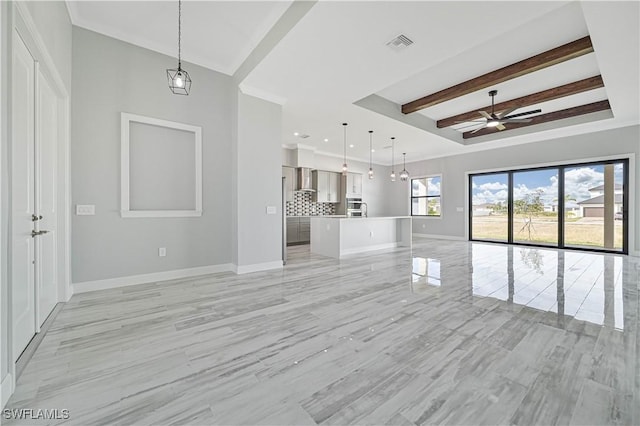 unfurnished living room with ceiling fan