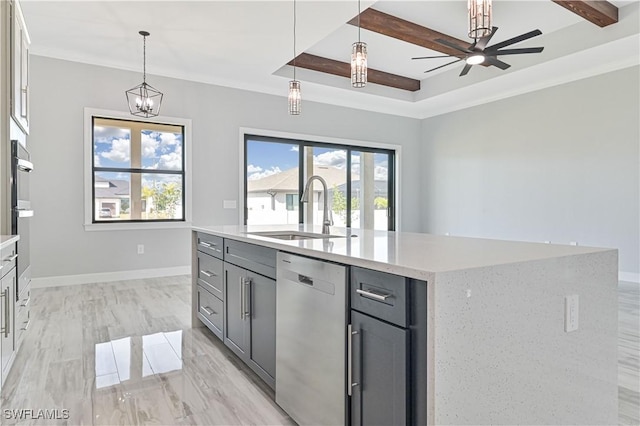 kitchen with stainless steel dishwasher, gray cabinetry, a kitchen island with sink, sink, and pendant lighting