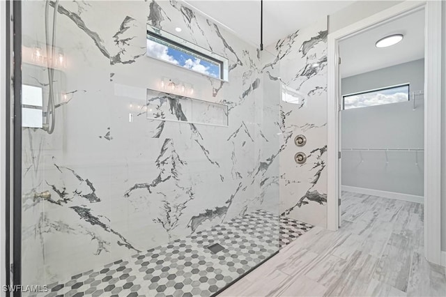 bathroom with a tile shower