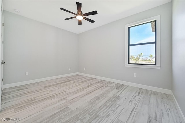 unfurnished room featuring ceiling fan and light hardwood / wood-style flooring