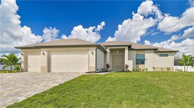 view of front of property featuring a garage and a front lawn