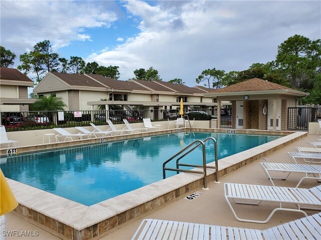 view of swimming pool with a patio