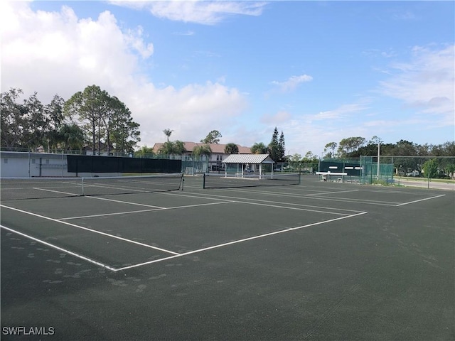 view of sport court with fence