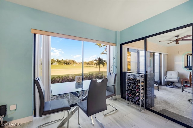 dining area with plenty of natural light and ceiling fan