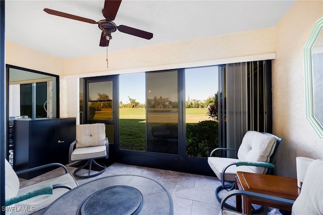 sunroom with a ceiling fan