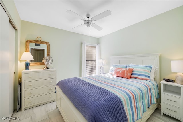 bedroom featuring ceiling fan and a closet