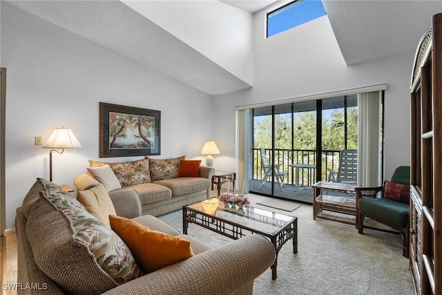 living room with light colored carpet and a high ceiling