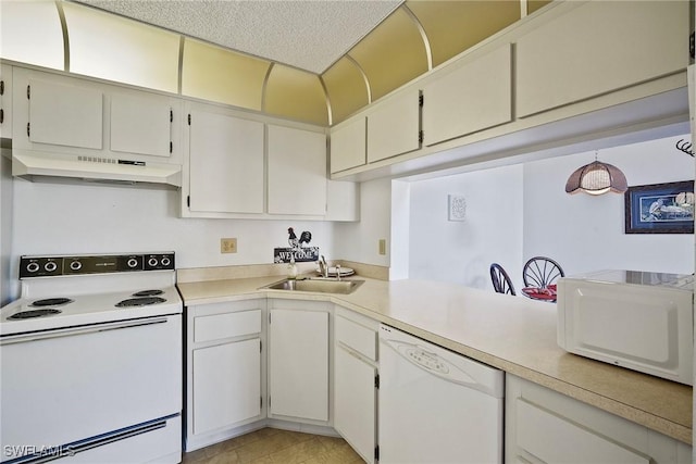 kitchen featuring white cabinetry, sink, and white appliances