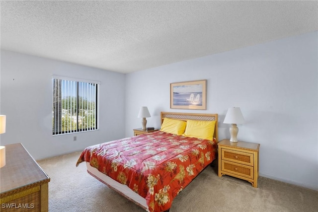 carpeted bedroom with a textured ceiling