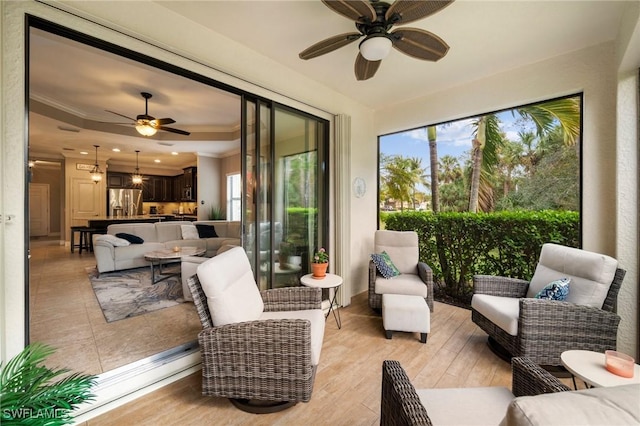 sunroom / solarium with ceiling fan