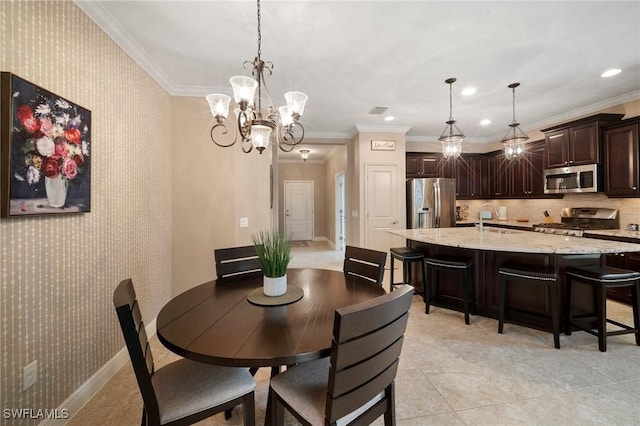 tiled dining space with sink, a notable chandelier, and crown molding