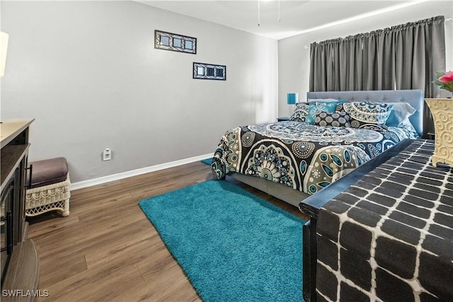 21 NE 19th Ter, Cape Coral, FL 33909 - bedroom featuring baseboards and wood finished floors