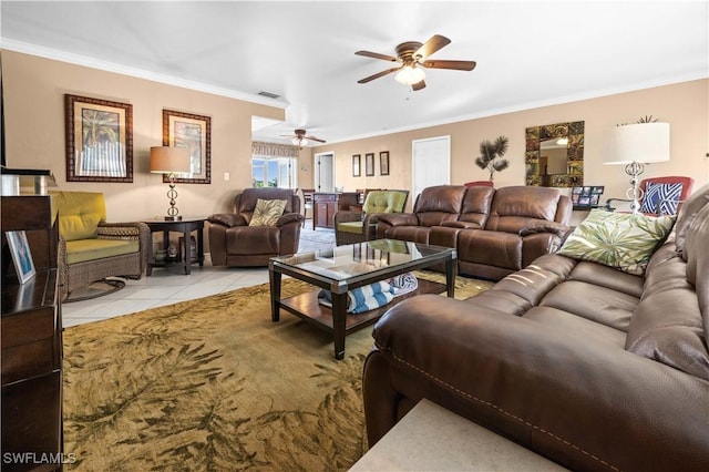 living room with light tile patterned floors, crown molding, and ceiling fan