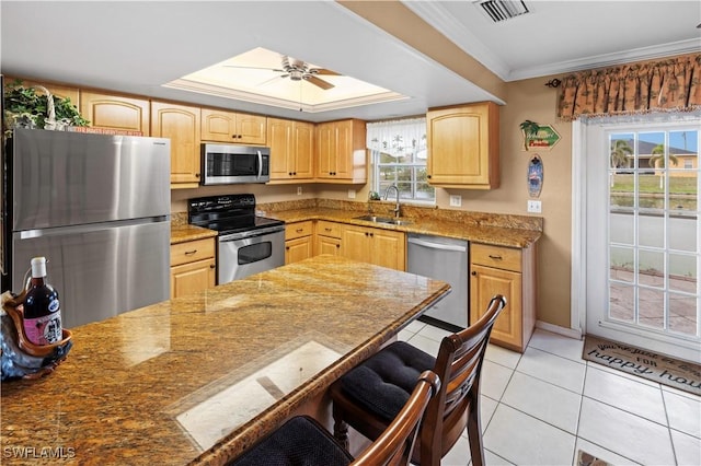 21 NE 19th Ter, Cape Coral, FL 33909 - kitchen featuring appliances with stainless steel finishes, visible vents, light brown cabinets, and a sink