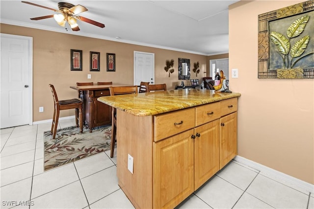 21 NE 19th Ter, Cape Coral, FL 33909 - kitchen with ornamental molding, light stone countertops, a kitchen breakfast bar, and ceiling fan