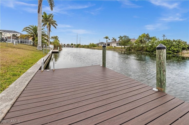 21 NE 19th Ter, Cape Coral, FL 33909 - view of dock with a lawn, a water view, and fence