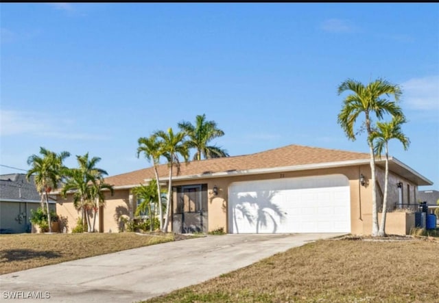 ranch-style house featuring a garage and a front yard