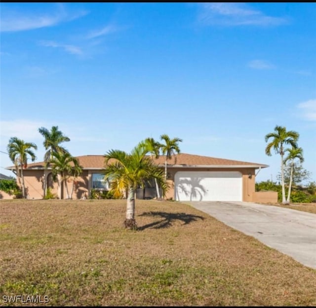 ranch-style home with a garage and a front yard